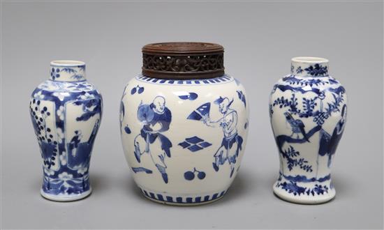 A 19th century Chinese blue and white ovoid jar, wood cover and two similar smaller vases tallest 15cm